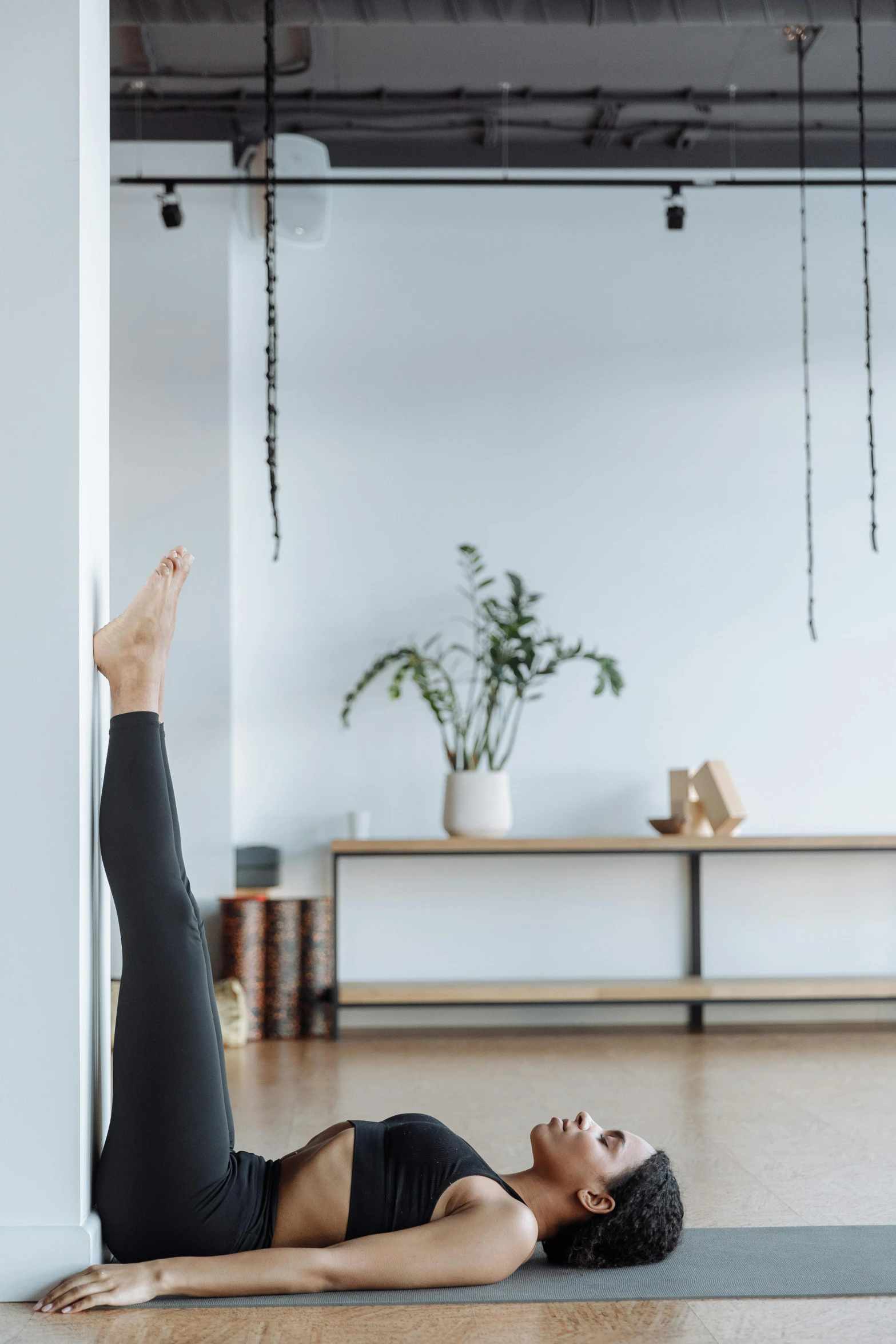 a woman doing a yoga pose on a yoga mat, a picture, by Jan Tengnagel, unsplash, arabesque, hung above the door, curated collections, square, panoramic shot