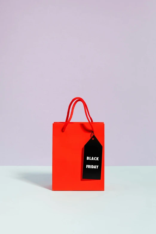 a red shopping bag with a black price tag on it, by Julia Pishtar, matte bright colors, f / 1, paper, 4