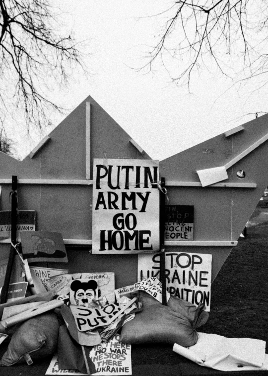 a black and white photo of a bunch of signs, a black and white photo, by Maurycy Gottlieb, putin, in front of the house, mobile, contain