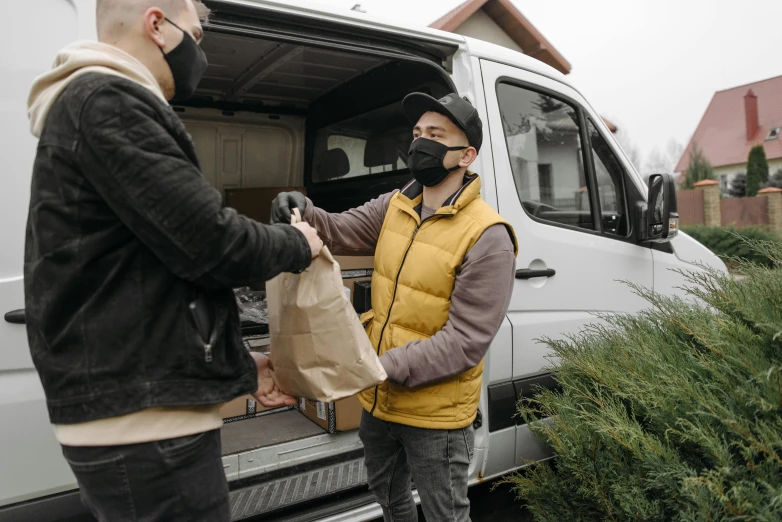 a couple of men standing next to a van, pexels contest winner, renaissance, getting groceries, white man with black fabric mask, profile image, warm