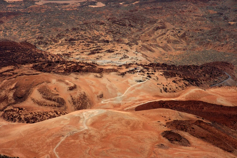 an aerial view of a valley in the desert, by Lee Loughridge, pexels contest winner, hurufiyya, red dusty soil, moonscape, manuka, slide show