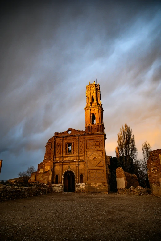 an old building with a clock tower in front of a cloudy sky, by Niklaus Manuel, explorers of the ruins at dusk, ocher, square, high quality photo