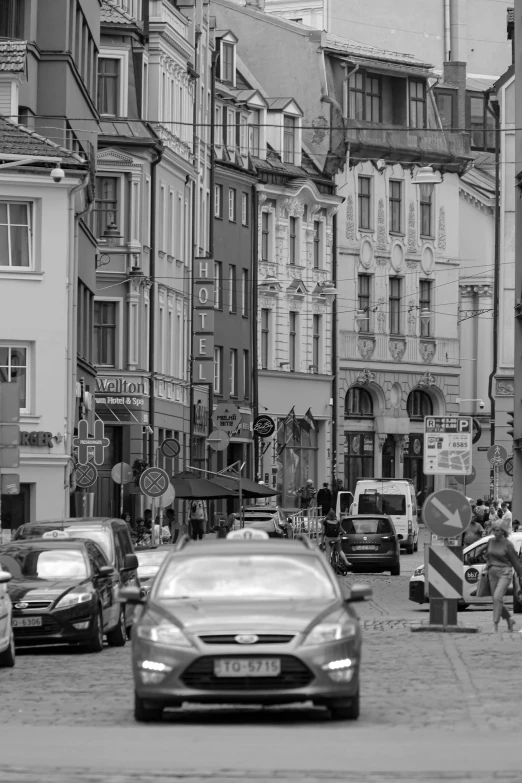 a black and white photo of a busy city street, a black and white photo, inspired by Thomas Struth, flickr, renaissance, in legnica!!!, one car, square, detmold