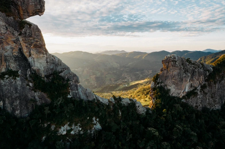 a view of the mountains from the top of a mountain, unsplash contest winner, les nabis, madagascar, traditional corsican, chiseled formations, natural morning light