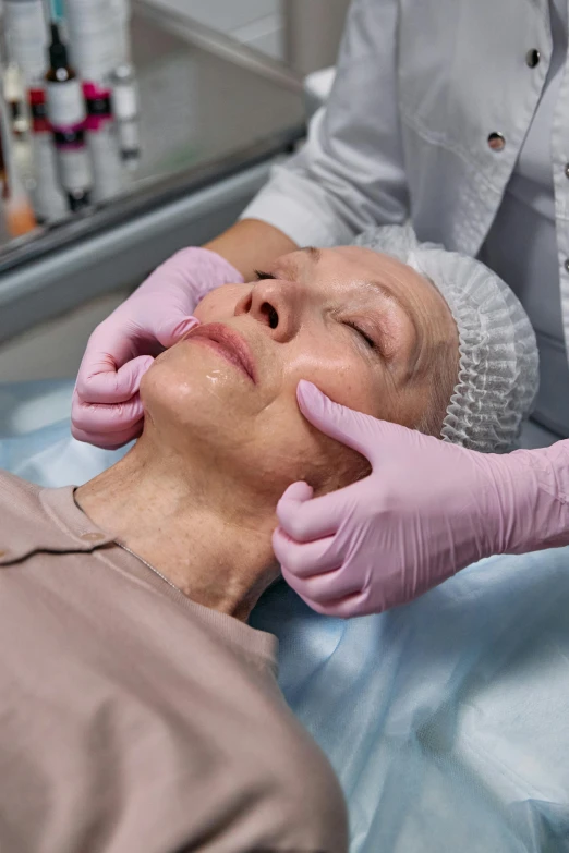 a woman getting an injection from a doctor, a digital rendering, renaissance, wrinkled face, subtle vibrancy, square facial structure, lynn skordal