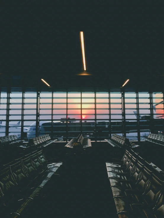 an airport terminal filled with lots of empty seats, inspired by Elsa Bleda, pexels contest winner, sunset view, 🚿🗝📝, album cover, transparent background