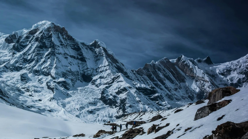 a group of people riding skis down a snow covered slope, a detailed matte painting, pexels contest winner, hurufiyya, nepal, avatar image, landscape photo, peaks