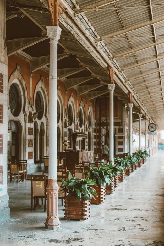 a train station filled with lots of tables and chairs, by Nina Hamnett, trending on unsplash, art nouveau, colombo sri lankan city street, 2 5 6 x 2 5 6 pixels, arches adorned pillars, turkey