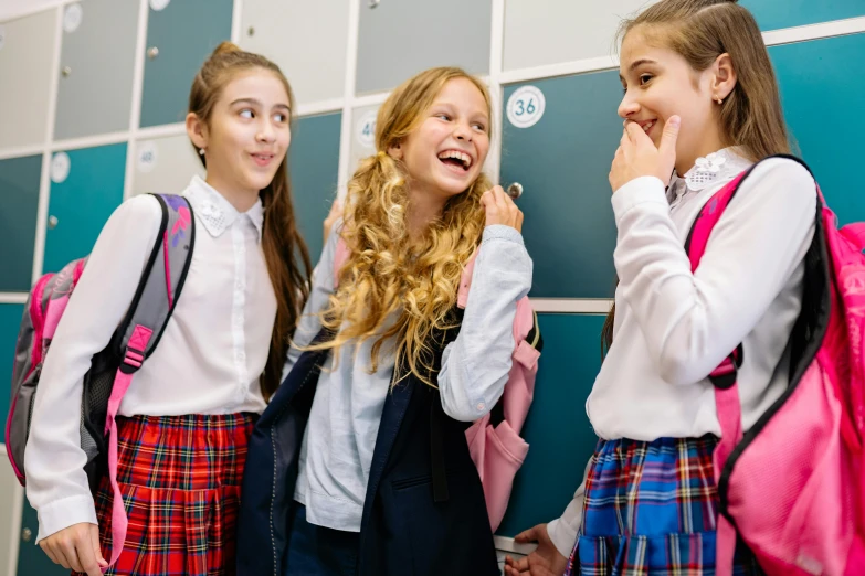a group of young girls standing next to each other, by Nicolette Macnamara, trending on pexels, happening, lockers, dressed as schoolgirl, she is laughing, 15081959 21121991 01012000 4k