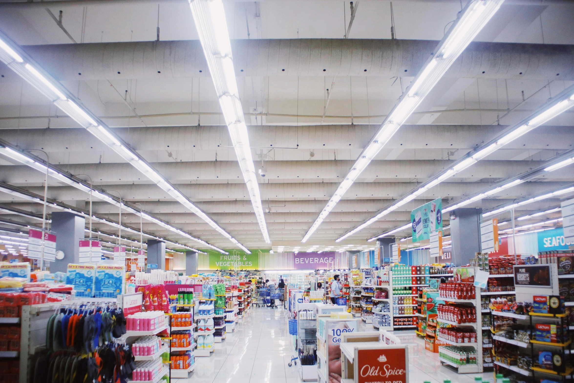 a store filled with lots of different types of goods, by Robbie Trevino, fluorescent lights from ceiling, inside a supermarket, profile image, quiet beauty