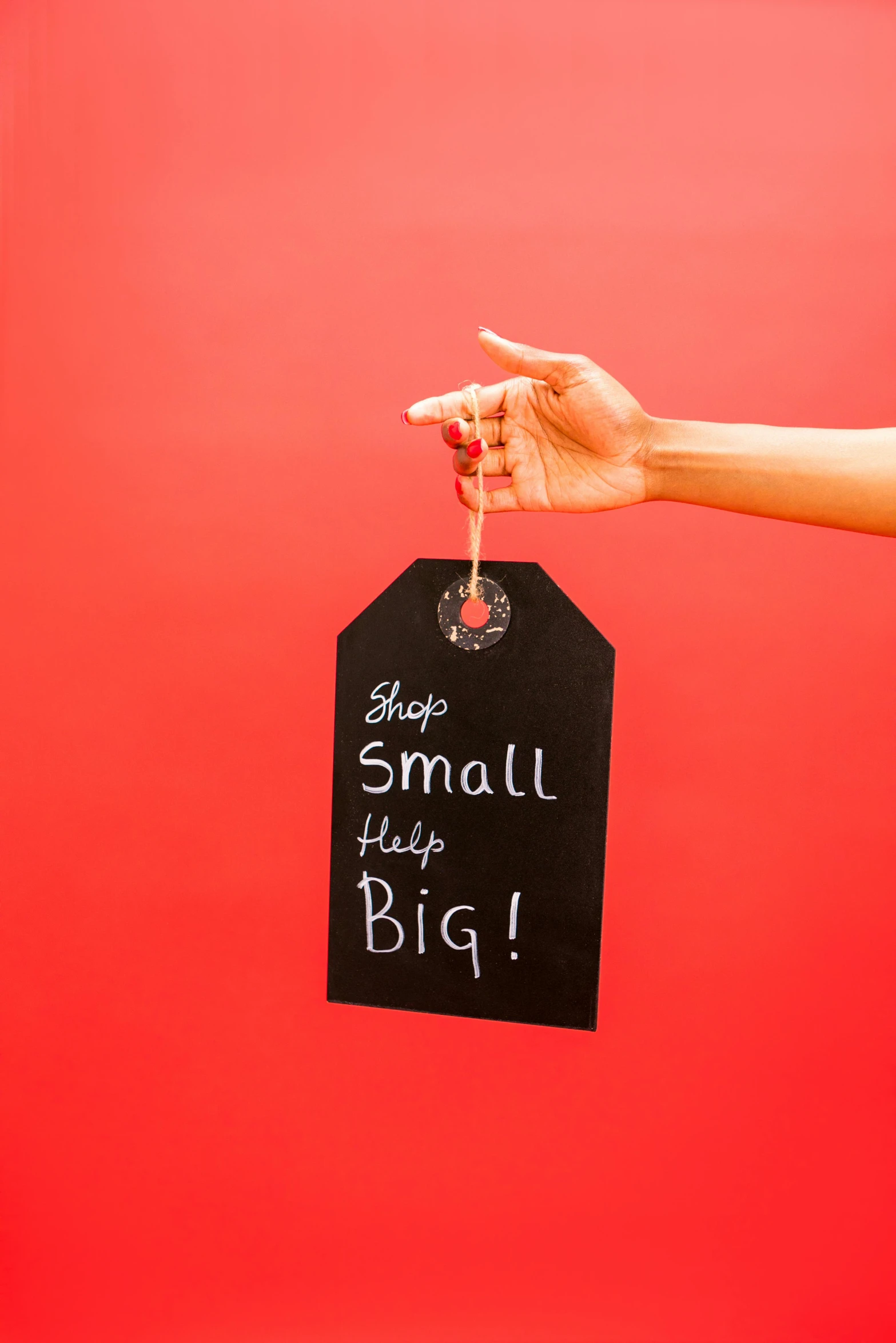 a person holding a wine glass in their hand, an album cover, by Paul Bird, pexels contest winner, subject action : holding sign, smol, chalkboard, high resolution print :1 red