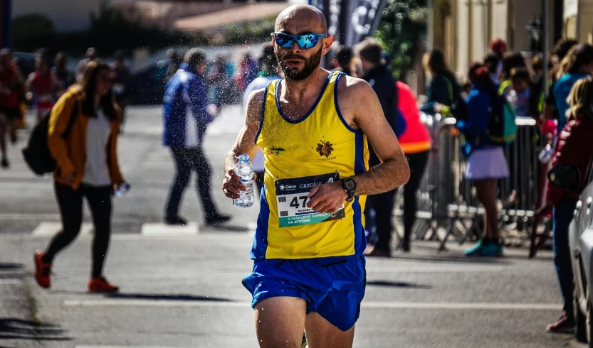 a man that is running in a race, by Giorgio Cavallon, pexels contest winner, renaissance, yellow sport glasses, costa blanca, half - length photo, thumbnail