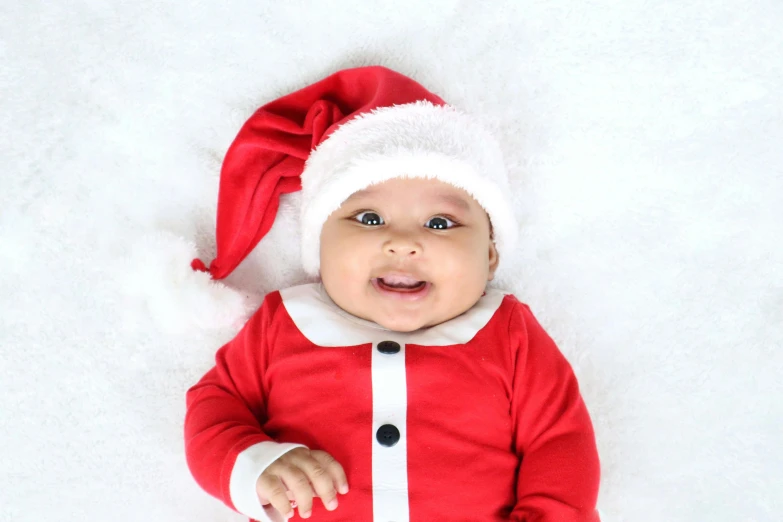 a close up of a baby wearing a santa suit, pexels, avatar image, press shot, ayan nag, instagram post