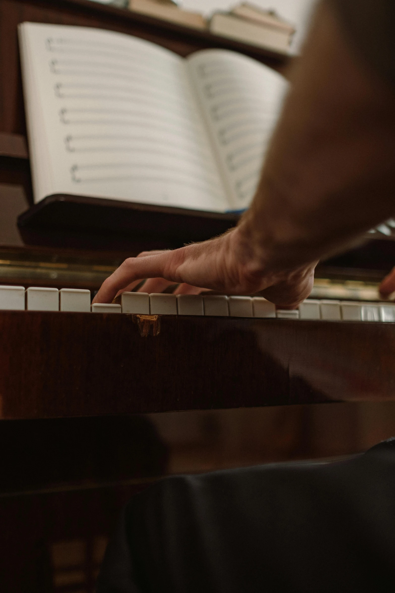 a close up of a person playing a piano, by David Simpson, paul barson, album, the music guy, hands not visible