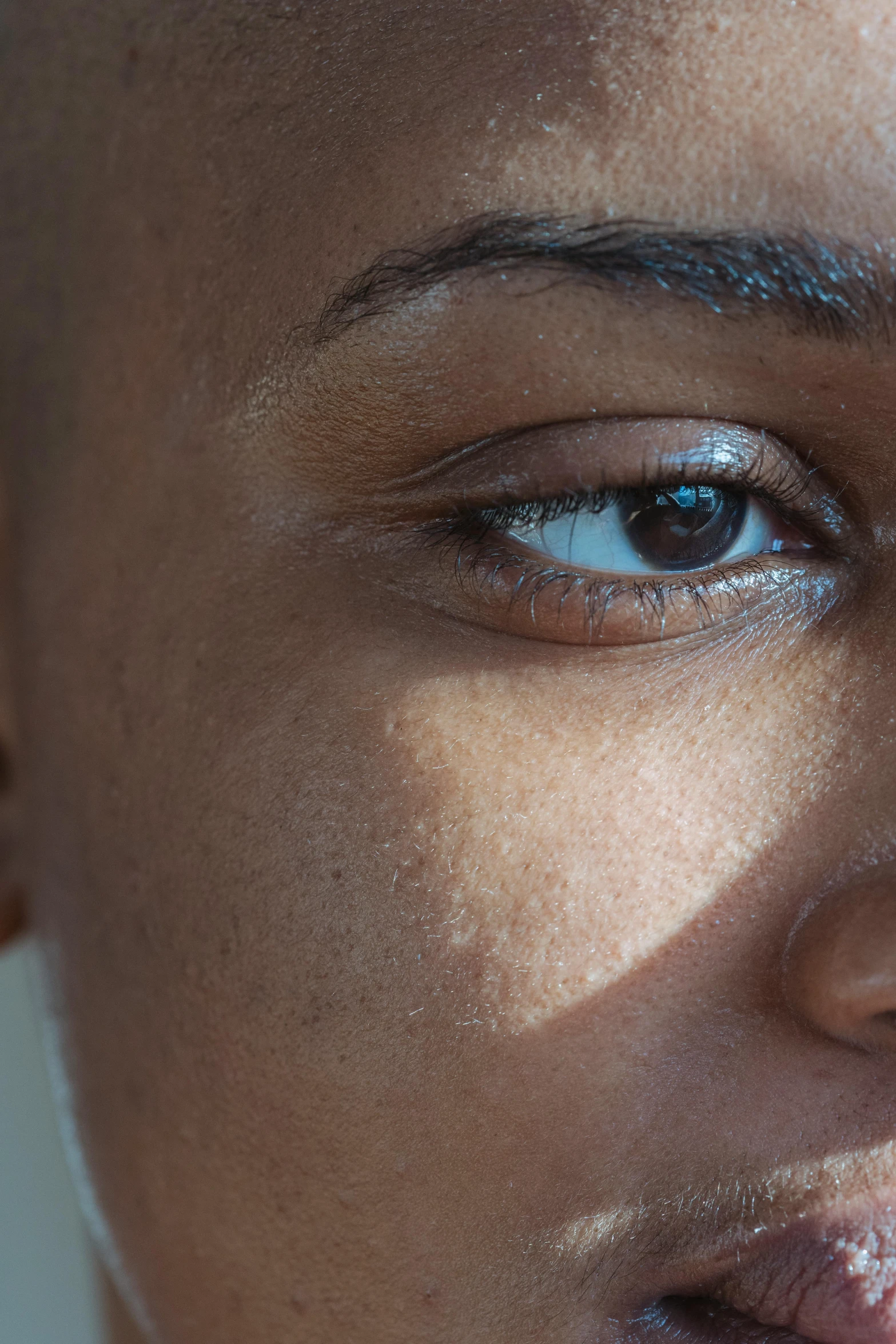 a close up of a person brushing their teeth, an album cover, by Lily Delissa Joseph, hyperrealism, eye in forehead, sunlight filtering through skin, black scars on her face, shaven face