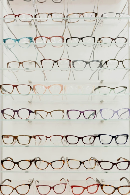 a display case filled with lots of different colored glasses, wearing eyeglasses, designer product, medium frame, wideangle