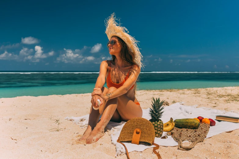 a woman sitting on top of a sandy beach, in the sun, travel guide, tans, avatar image