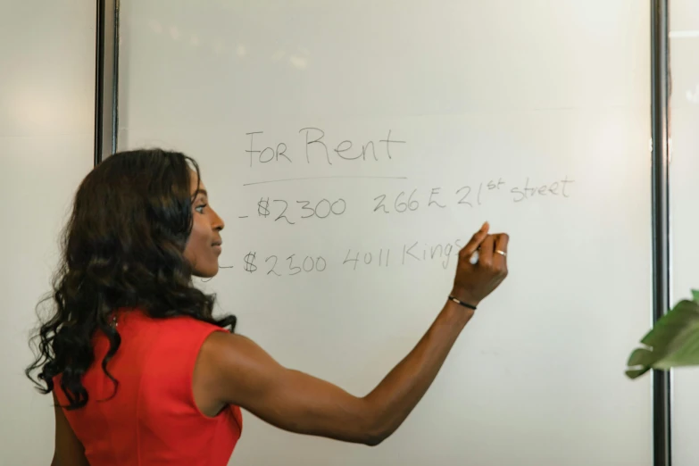 a woman in a red dress writing on a white board, a photo, by Robert Lee Eskridge, trending on reddit, olivia pope, math, 15081959 21121991 01012000 4k, square