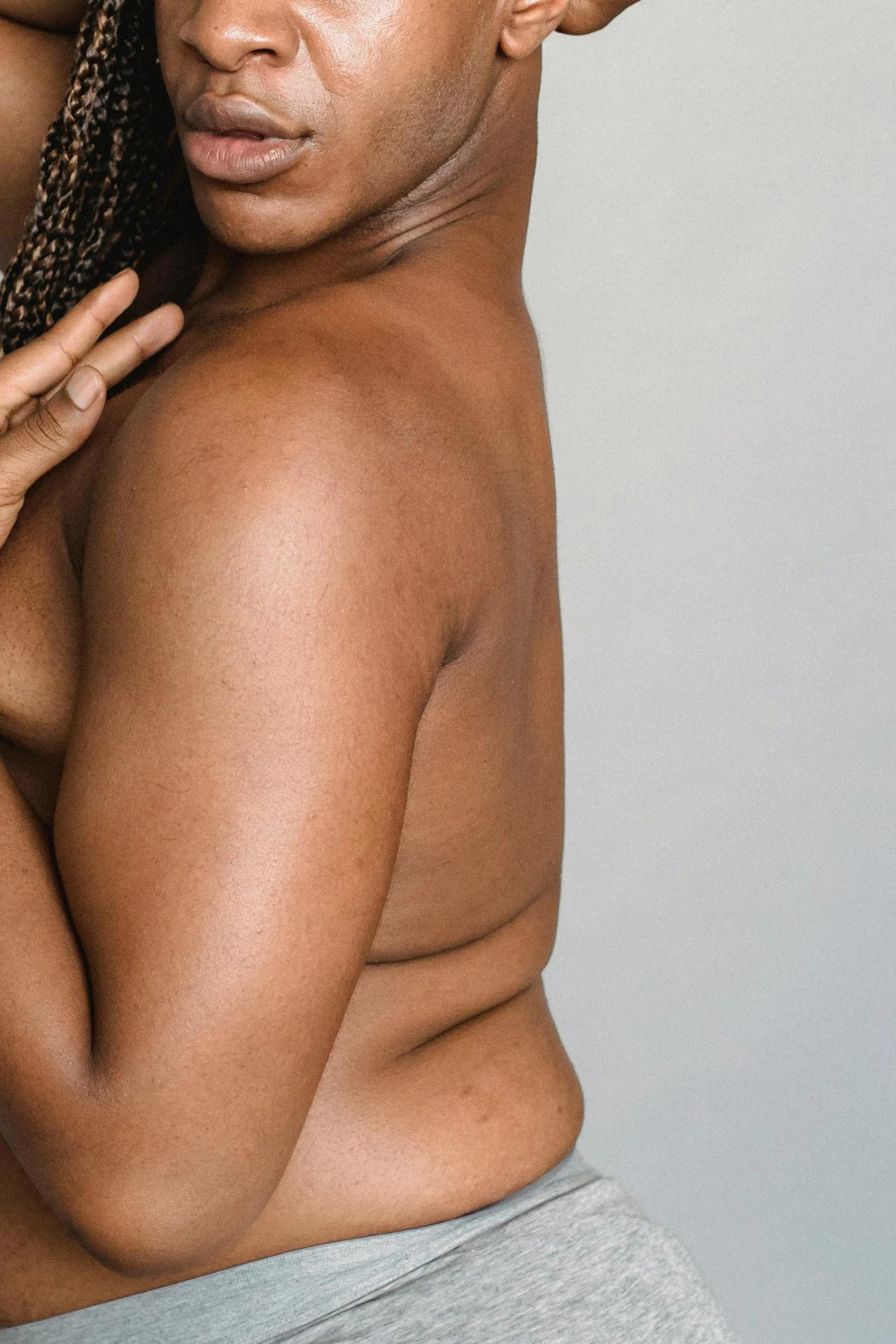 a man and a woman posing for a picture, an album cover, by Matija Jama, trending on pexels, renaissance, curvy body, her skin is light brown, woman's profile, fleshy musculature