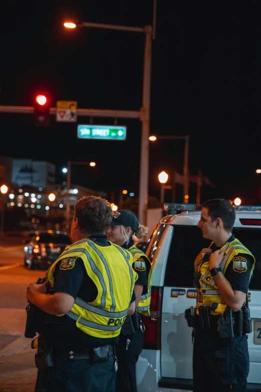 a couple of men that are standing in the street, reddit, happening, police lights, alabama, high resolution photo, upset