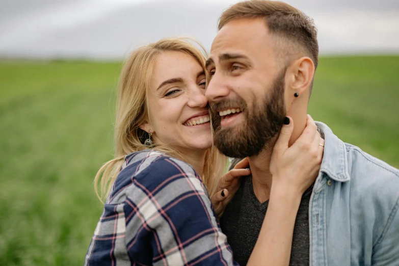 a man and woman embracing in a field, pexels contest winner, happening, well trimmed beard, excited russians, smiling :: attractive, rectangle