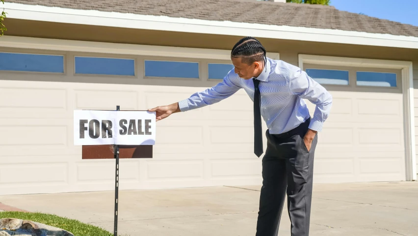 a man standing in front of a for sale sign, avatar image, neighborhood, trending photo, thumbnail