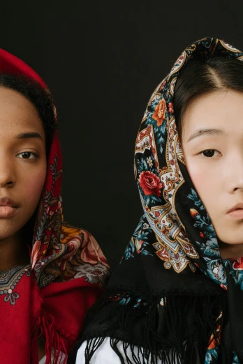 a couple of women standing next to each other, trending on unsplash, hyperrealism, wearing a scarf, oriental face, official dior editorial, photo of a black woman