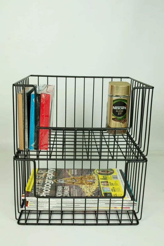 a wire basket filled with books and magazines, inspired by Donald Judd, hyperrealistic n- 4, the black box, crisp image