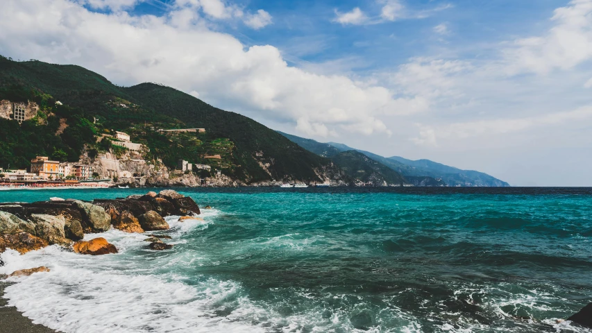 a rocky beach next to a body of water, pexels contest winner, renaissance, cinq terre, ocean swells, 2 5 6 x 2 5 6 pixels, lush surroundings