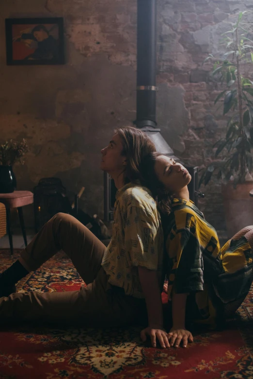 two women sitting on a rug in a living room, by Elsa Bleda, trending on pexels, visual art, jamie campbell bower, sun behind him, still from a music video, laying on their back