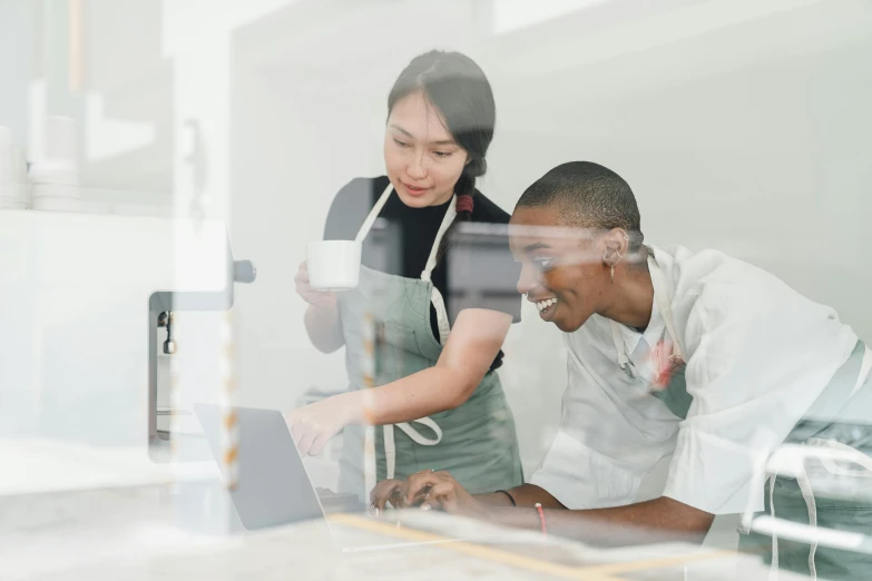 a couple of people that are looking at a laptop, pexels contest winner, engineer, varying ethnicities, thumbnail, te pae