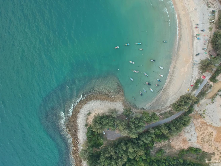 a large body of water next to a sandy beach, by Thomas Furlong, pexels contest winner, happening, top down view, straya, campsites, boats in the water