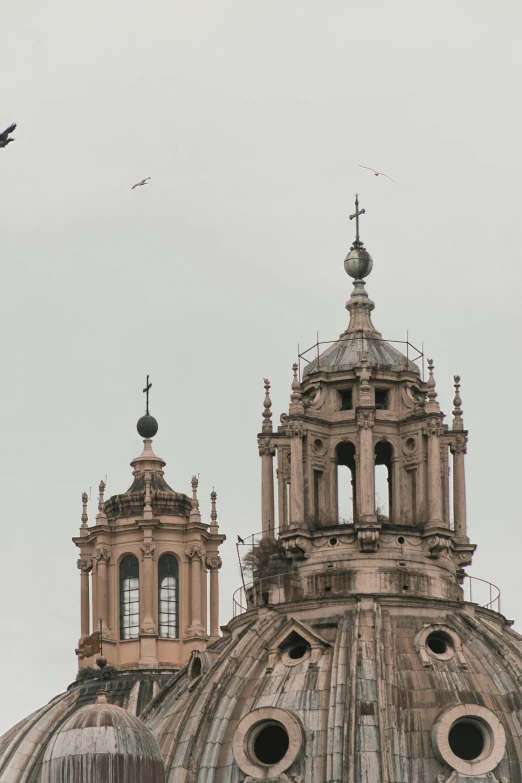 a church with a bird flying in front of it, pexels, quito school, seville, helicopters, low quality photo, rome