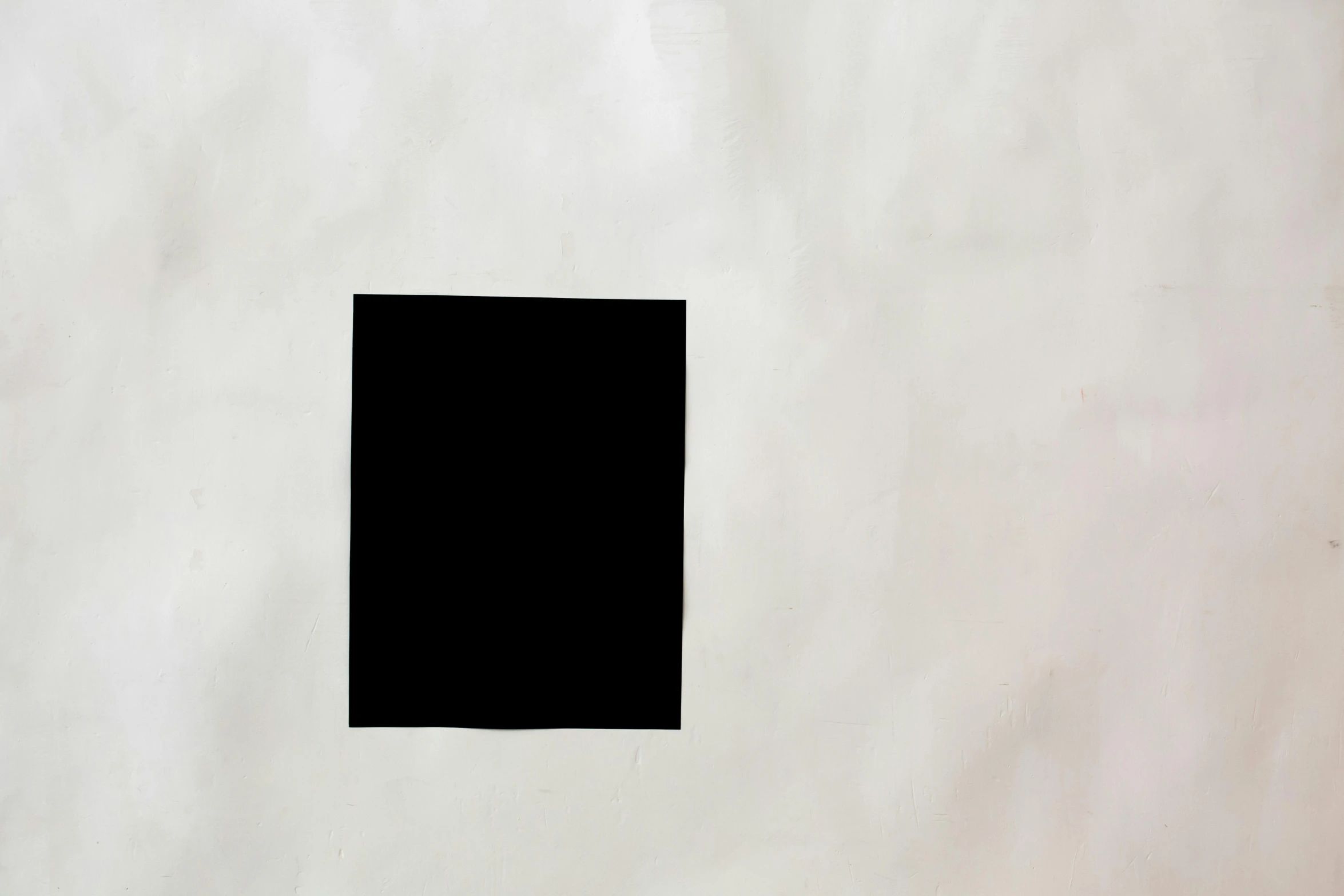 a black square sitting on top of a white sheet of paper, inspired by Malevich, unsplash, 144x144 canvas, black stencil, vertical portrait, without text