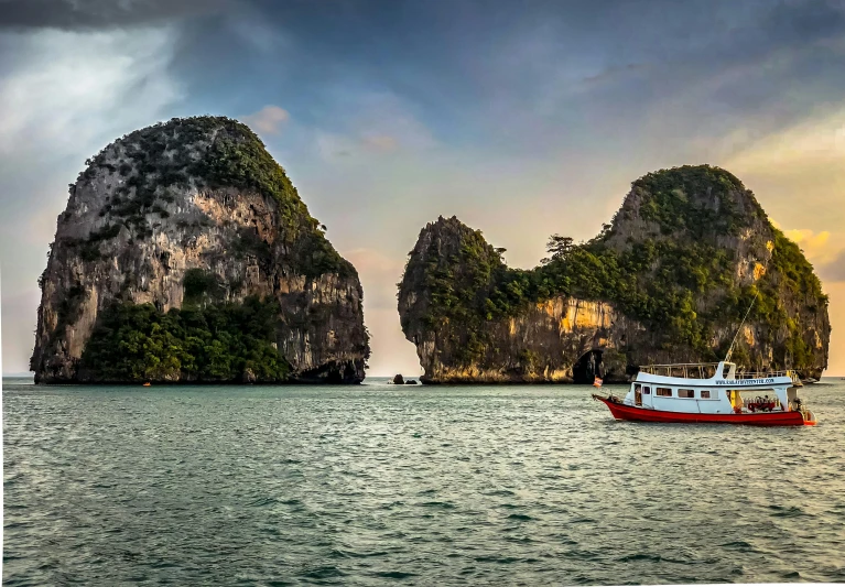 a boat in the middle of a body of water, by Raymond Han, pexels contest winner, limestone, south east asian with long, panorama shot, fan favorite