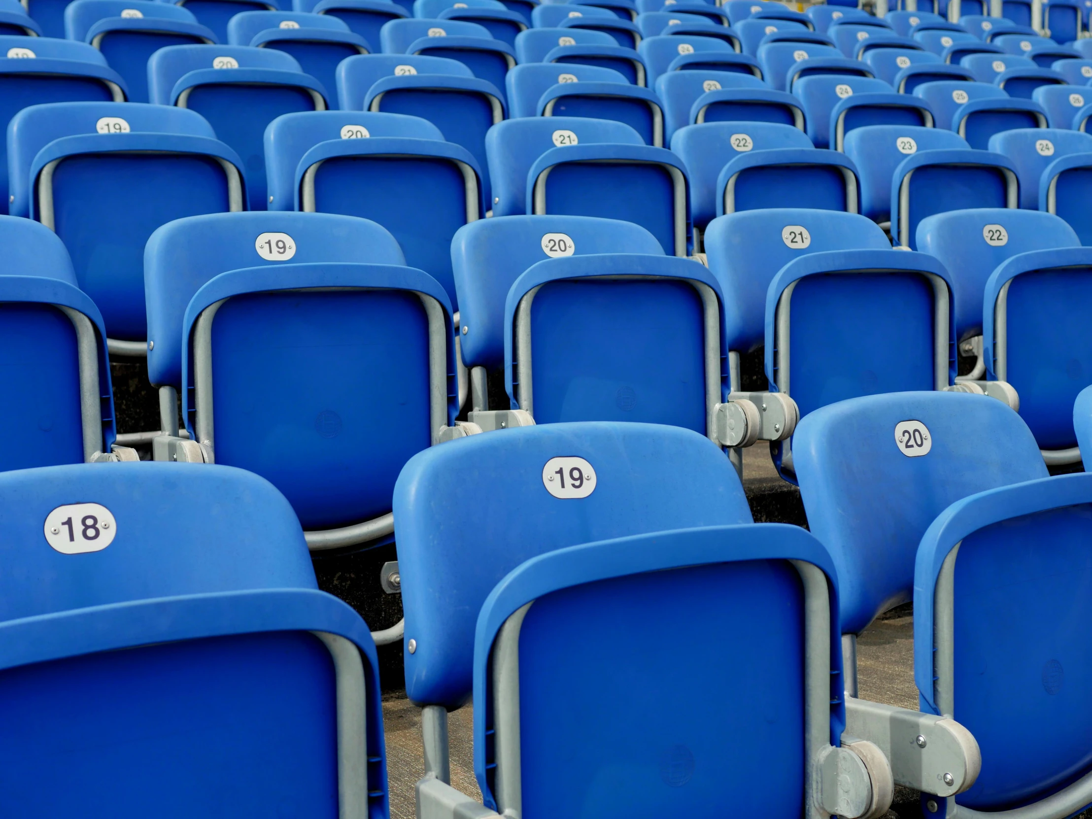 a row of blue stadium seats with numbers on them, pexels contest winner, conceptual art, instagram post, where's wally, plastic chair, dezeen