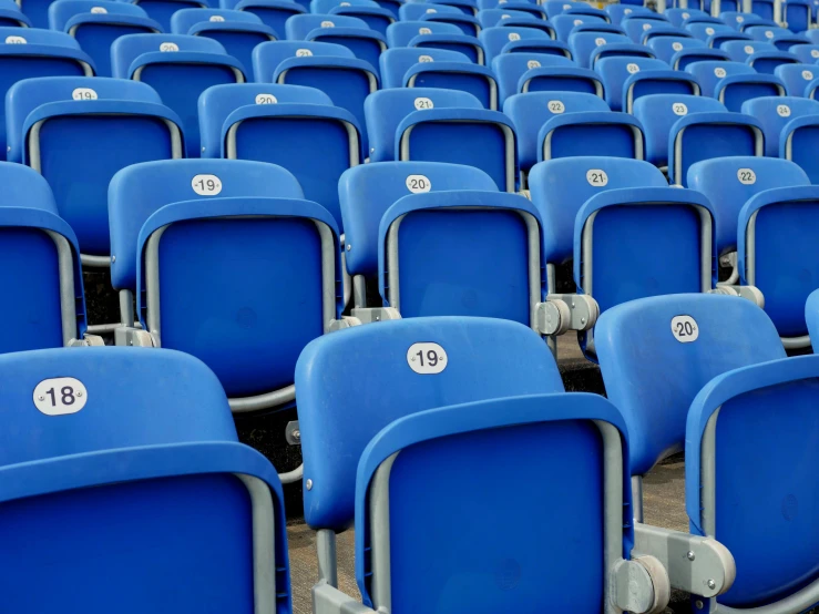 a row of blue stadium seats with numbers on them, pexels contest winner, conceptual art, instagram post, where's wally, plastic chair, dezeen