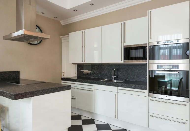 a kitchen with a black and white checkered floor, inspired by Albert Paris Gütersloh, unsplash, bauhaus, granite, highest quality, on ocean, listing image