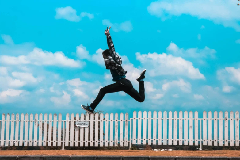 a man flying through the air while riding a skateboard, pexels contest winner, happening, standing astride a gate, avatar image, blue skies, cloud jumper