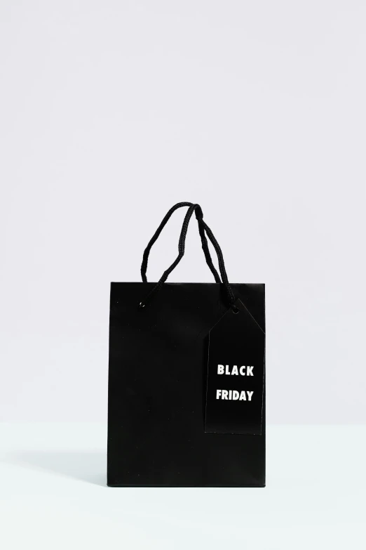 a black friday shopping bag on a white surface, by Nina Hamnett, label, black, 1x, no color