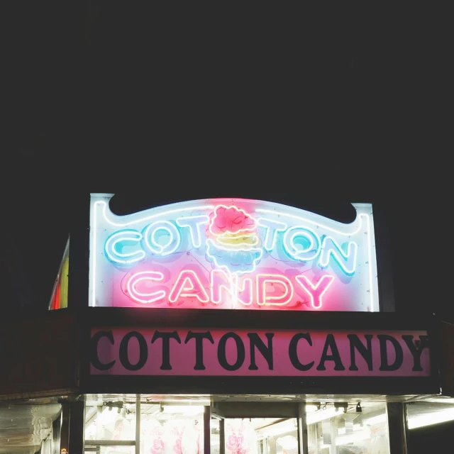a cotton candy store lit up at night, a colorized photo, trending on unsplash, pop art, ☁🌪🌙👩🏾, lots of white cotton, spooky photo, candy apple