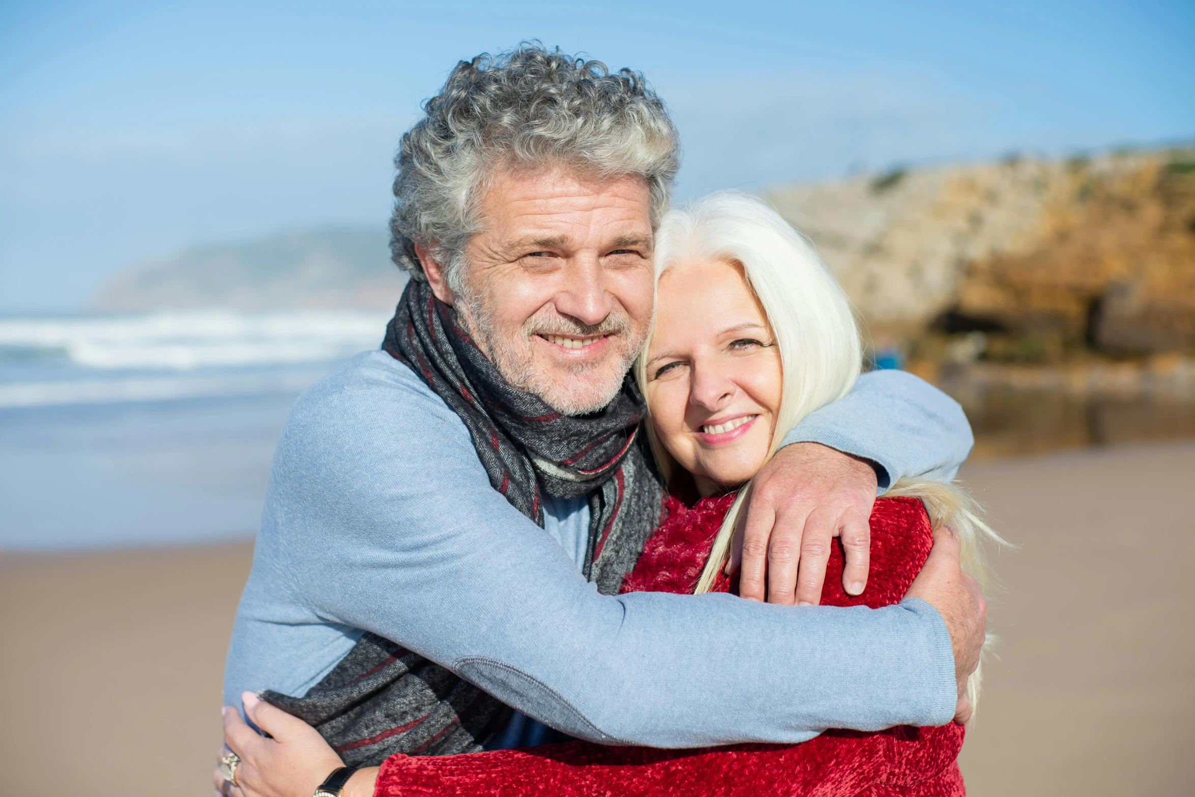 a man and woman hugging on the beach, pexels contest winner, renaissance, relaxed dwarf with white hair, confident looking, avatar image, mature male