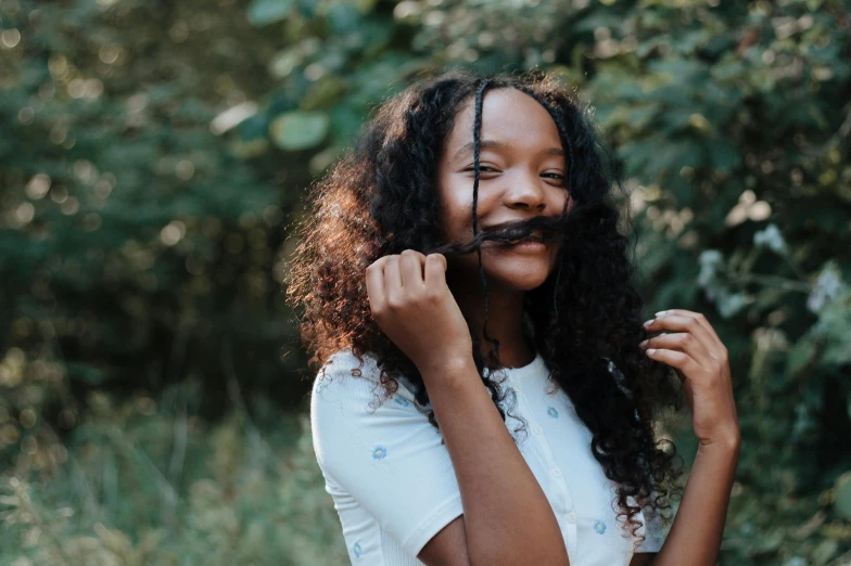 a woman with long curly hair and a moustache, pexels contest winner, happening, black teenage girl, hair made of trees, flat ironed hair, thumbnail