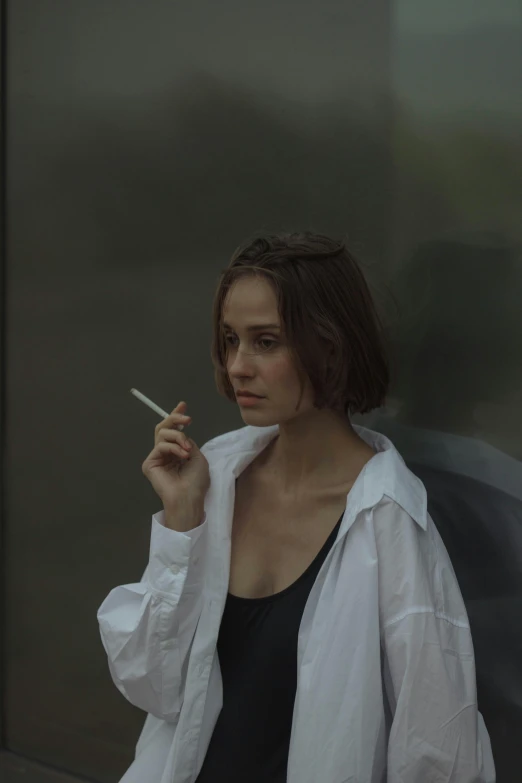 a woman with an umbrella smoking a cigarette, inspired by Nan Goldin, pexels contest winner, hyperrealism, alicia vikander, wearing a light shirt, androgynous male, kiko mizuhara
