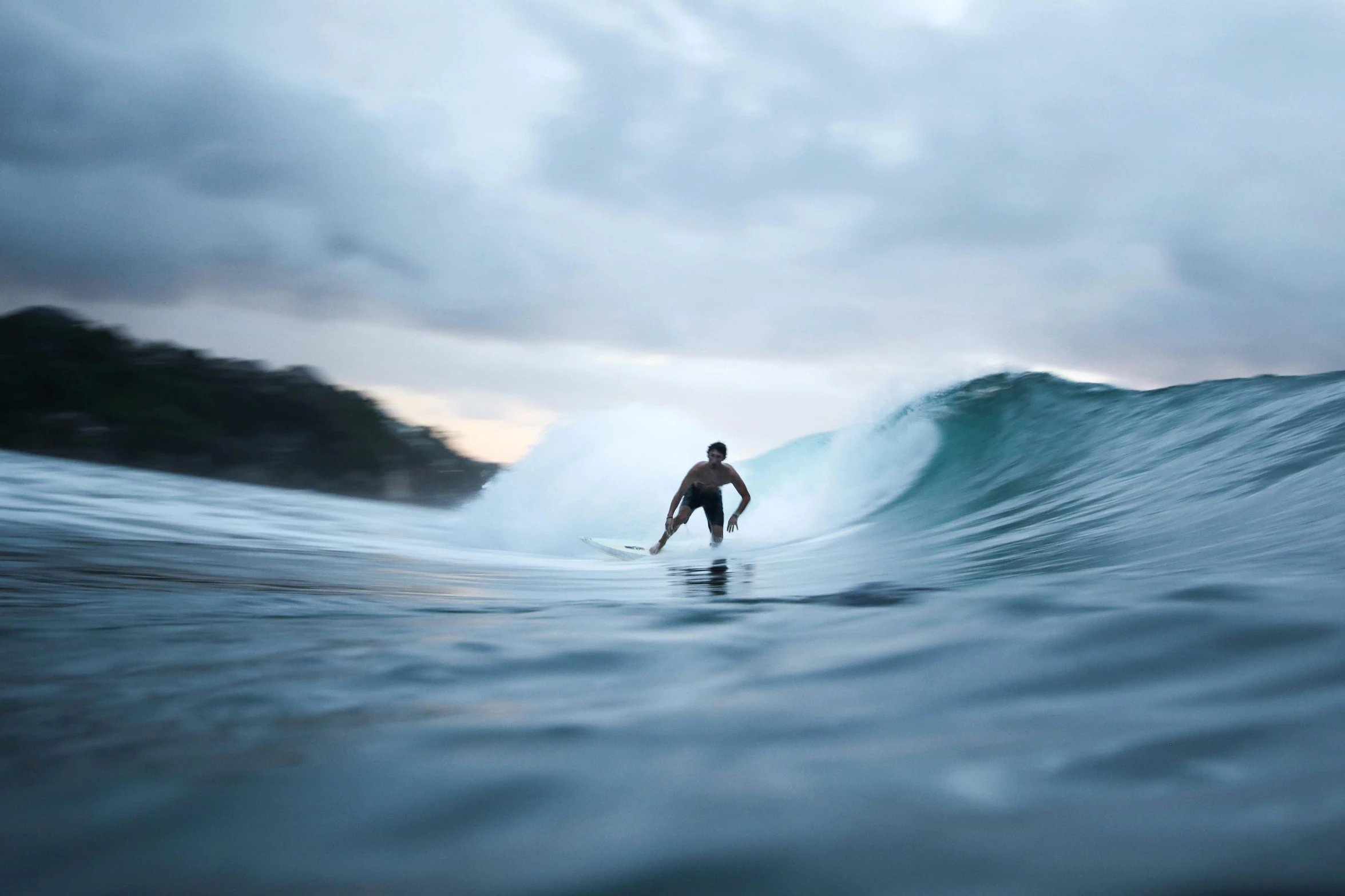 a man riding a wave on top of a surfboard, by Neil Boyle, unsplash contest winner, overcast, fan favorite, still frame, australian