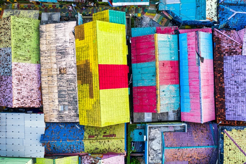 a bunch of colorful boxes stacked on top of each other, inspired by Jodorowsky, pexels contest winner, color field, aerial shot from the drone, manila, dilapidated houses, instagram post