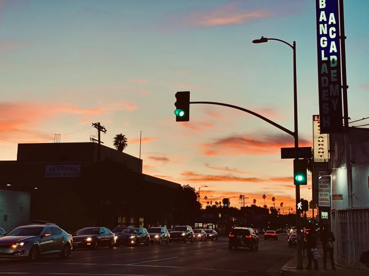 a traffic light sitting on the side of a road, by Carey Morris, unsplash contest winner, renaissance, hollywood scene, city sunset, billboard image