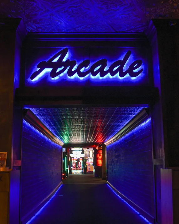 the entrance to the arcade is lit up with blue lights, an album cover, arcadia, thumbnail, nightlife, promo image