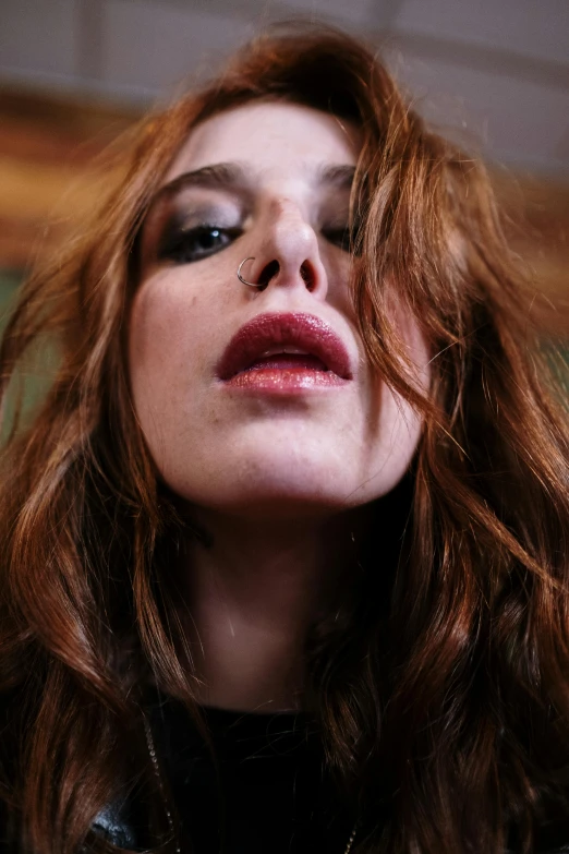 a close up of a woman with long red hair, an album cover, inspired by Nan Goldin, featured on reddit, renaissance, feral languid emma roberts, tongue out, stoya, handsome girl
