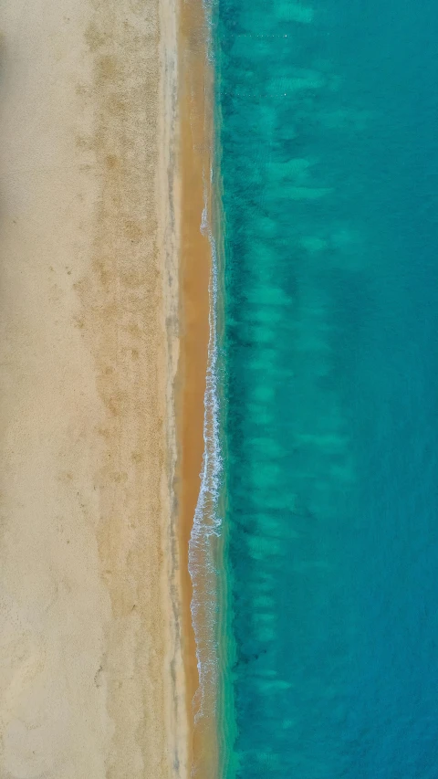 an aerial view of a beach next to a body of water, by Robbie Trevino, chicago, postprocessed, red sea, cyan